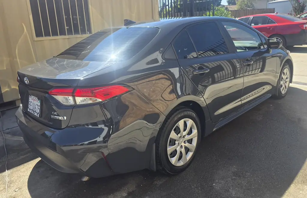 The same Toyota Corolla after repair, rear three-quarter view