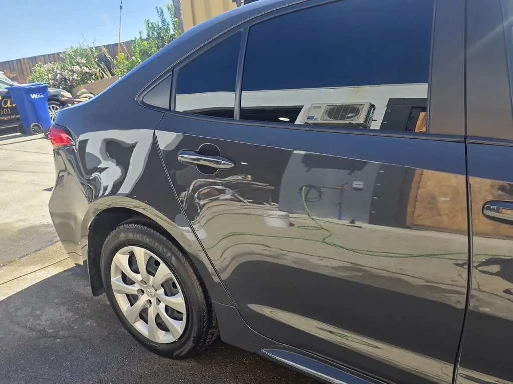 The repaired Corolla side and rear quarter panel after paint
